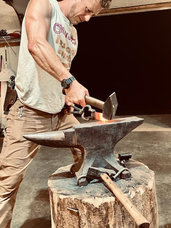 The maker forging a blade